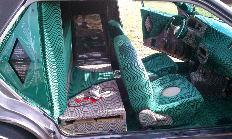 Illustration for article titled For $2,300, this custom Escort lowrider hearse lets you go in style
